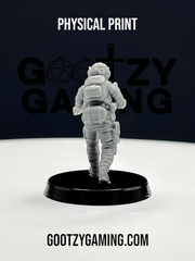 a toy astronaut is standing on a black base