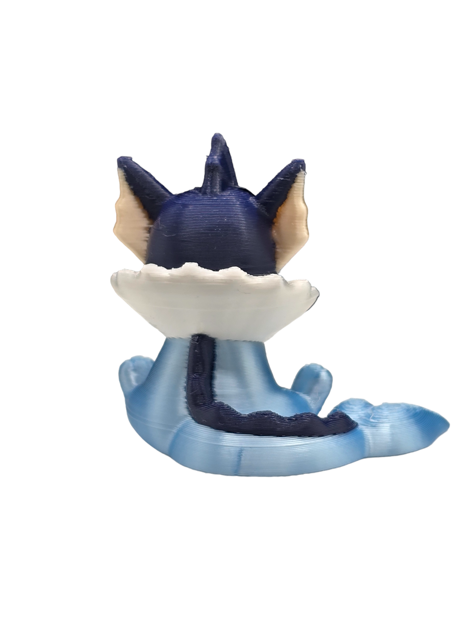 a blue and white figurine of a cat