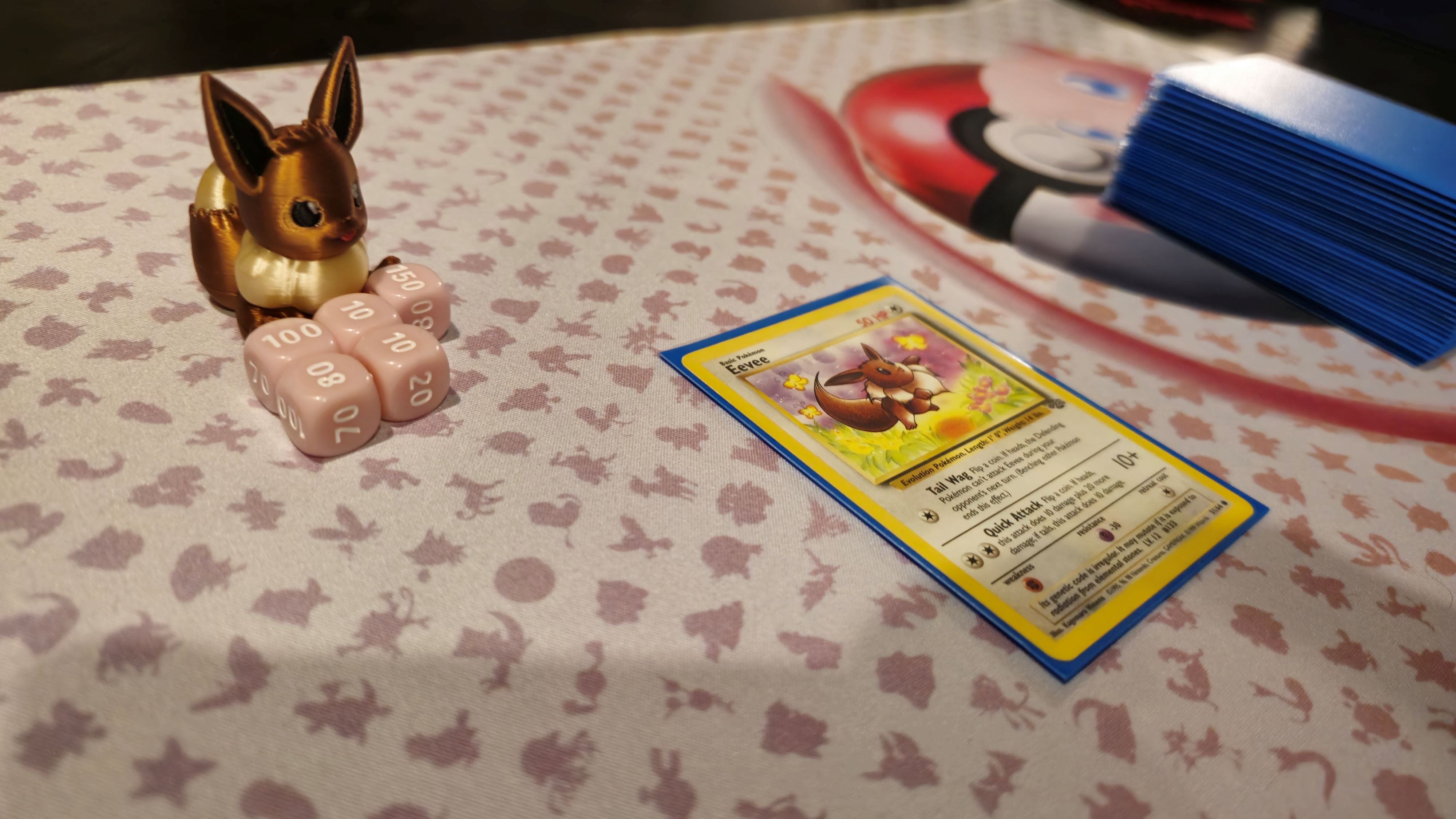 a close up of a table with a pokemon trading card