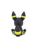 a black and yellow toy with yellow eyes